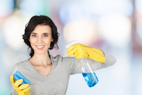 Team member checking cleaning equipment and following safe procedures