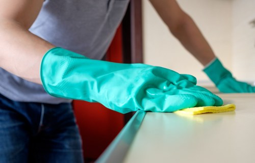 Local technician inspecting a sofa before cleaning in Balham