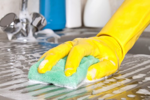 Domestic cleaning tasks in a Balham kitchen and living area